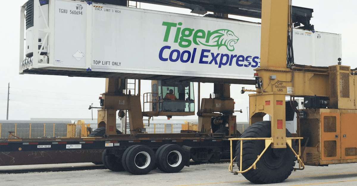 Moving a refrigerated intermodal container between drayage truck and rail car