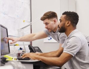 Dat People Brokers Reviewing Computer Screen