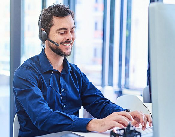 Man Sitting On Desk