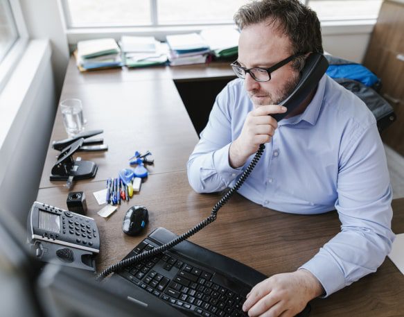 DAT People Broker On Phone Office