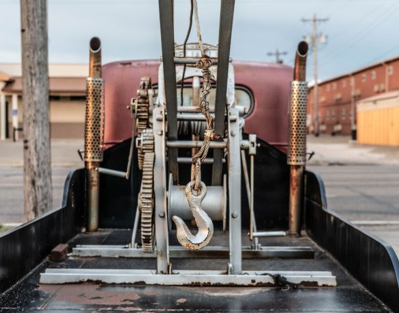 A Vehicle Used For Drop And Hook Trucking Sits In A Parking Lot