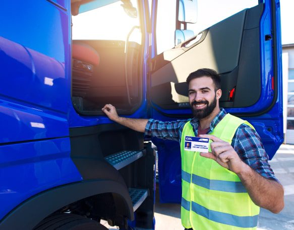 Truck Driver Holding His Commercial Drivers License