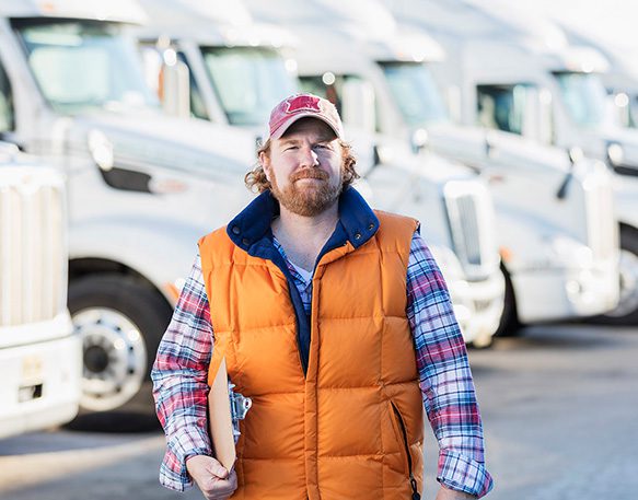 DAT People Driver Clipboard In Front Of Truck Fleet