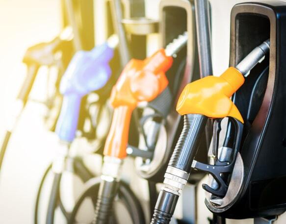 A row of fuel dispensers at a gas station