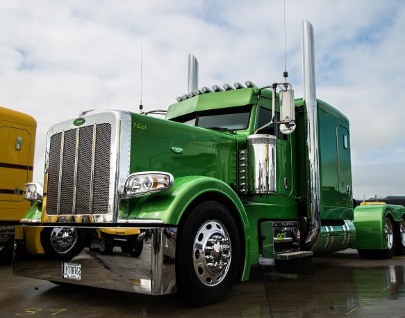 Large truck cab sitting in parking lot.