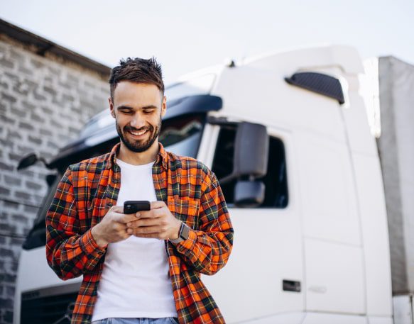 A carrier hears from their truck dispatcher via their phone.