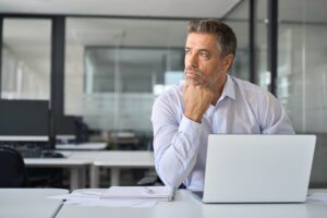 Shipper reviewing freight shipping bids and DAT iQ market data to compare carrier rates and plan a faster, smarter mini-bid