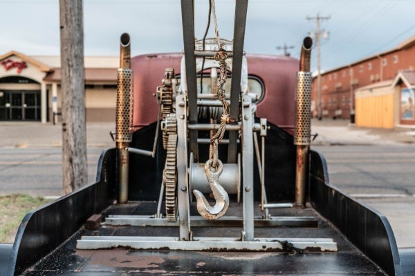 A vehicle used for drop and hook trucking sits in a parking lot.
