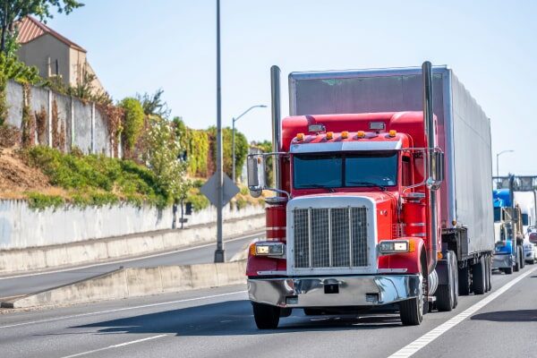 Large truck driving down the highway.